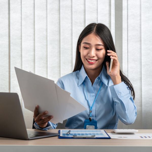 a professional individual is looking at documents